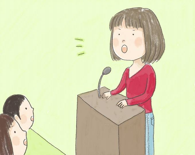 【イラスト】真剣な表情でスピーチをする、むらたさんのイラスト